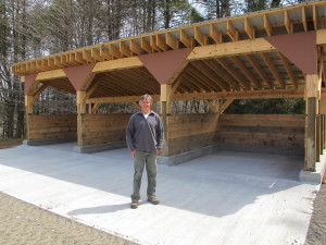 Builder Jon Fahan with the composting shed