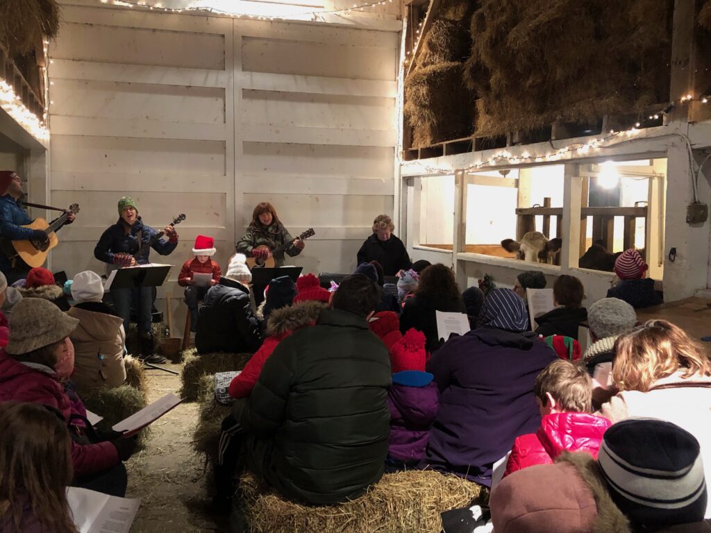 Caroling in the Barn with the Animals